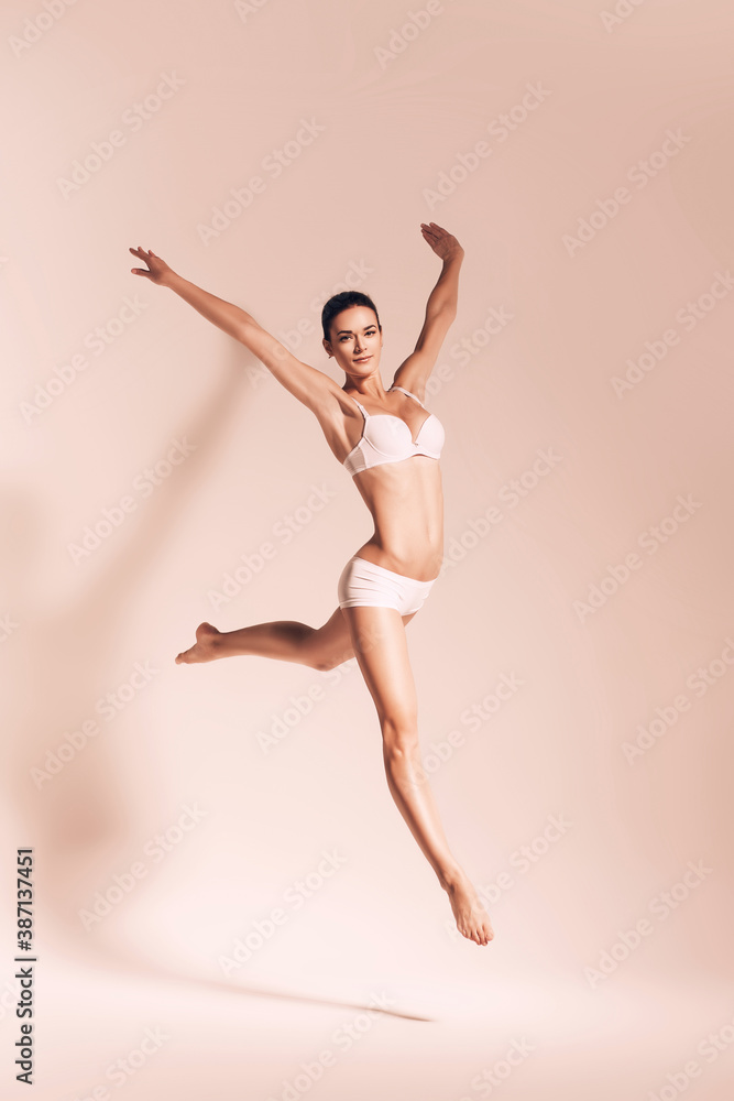 sepia jumping woman in underwear sepia jumping woman in underwear