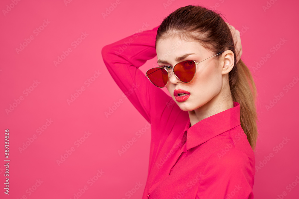 Woman in pink shirt and brown glasses cropped view fashion model emotions gesturing hands portrait Woman in pink shirt and brown glasses cropped view fashion model emotions gesturing hands portrait