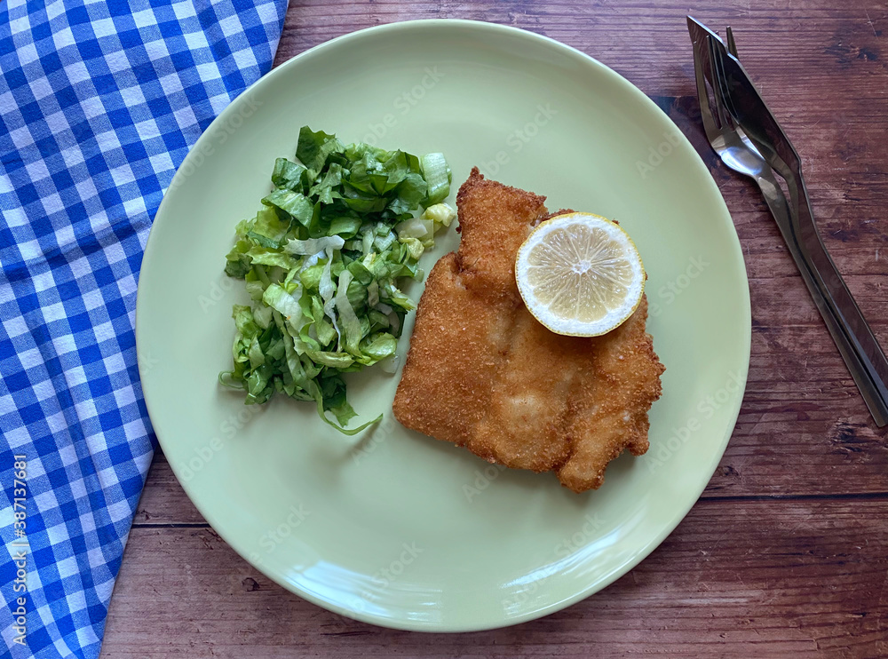 Breaded cod fish fillet, also known as Kabeljau. The fish is coated in