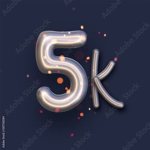 Silver balloon 5k sign on dark blue background.