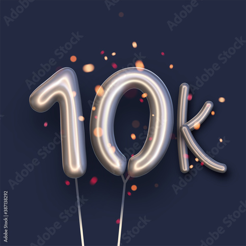 Silver balloon 10k sign on dark blue background.