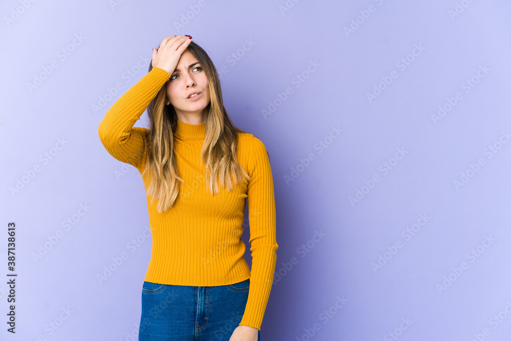 Young caucasian woman isolated on purple background forgetting something, slapping forehead with palm and closing eyes. Young caucasian woman isolated on purple background forgetting something, slapping forehead with palm and closing eyes.