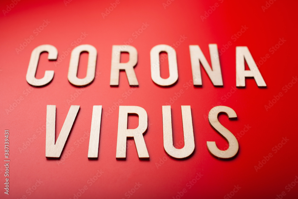 coronavirus word text wooden letter on red background corona virus covid-19