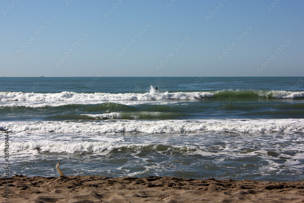Surfing in corona times at Forte dei Marmi, Tuscany, Italy Surfing in corona times at Forte dei Marmi, Tuscany, Italy