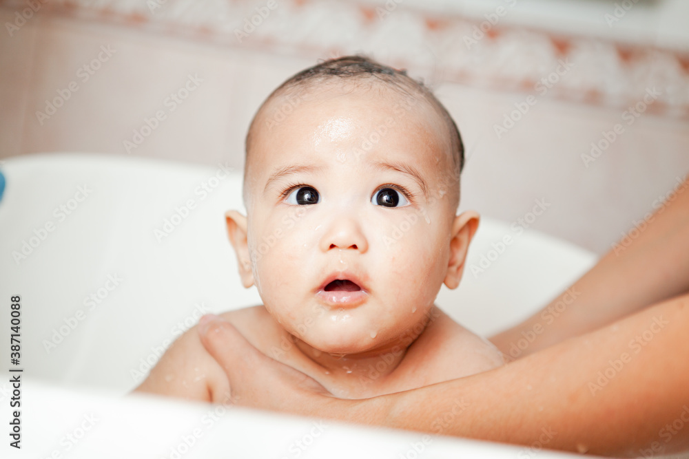 Cute happy Baby Taking Bath
