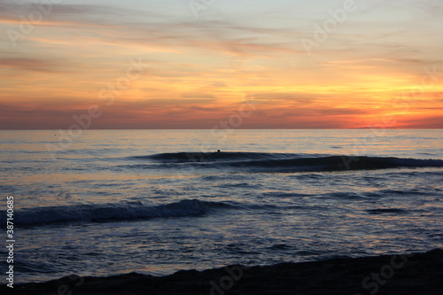 Surfing in corona times at Forte dei Marmi, Tuscany, Italy