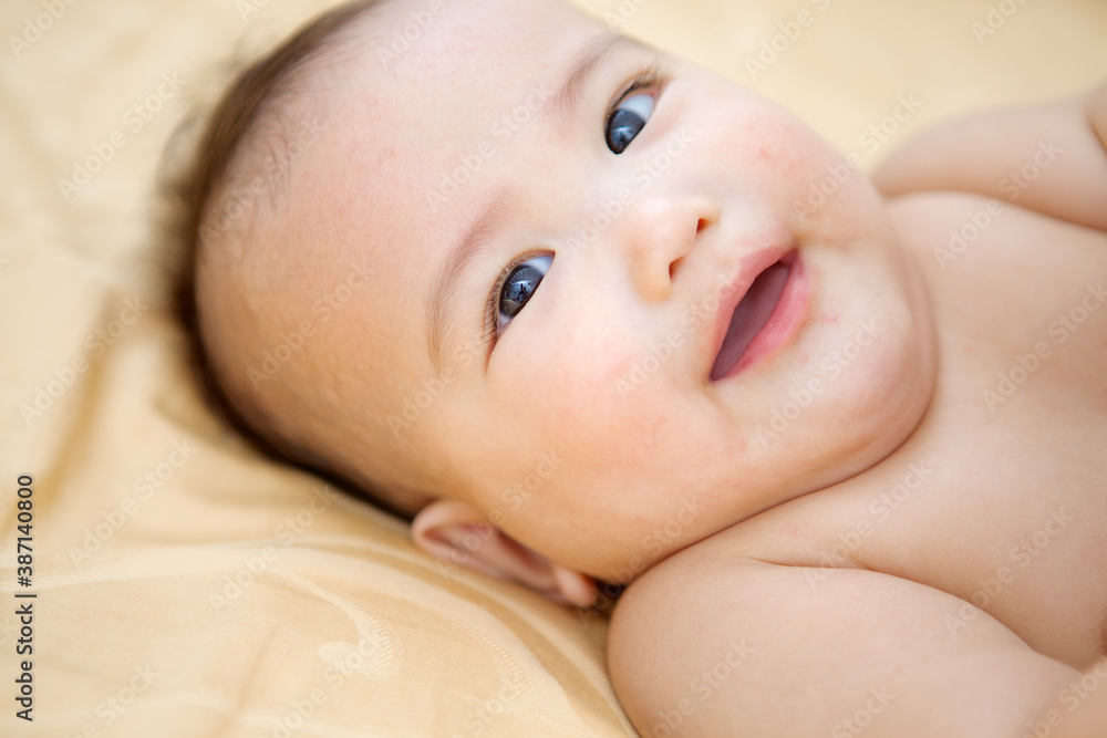 Cute Baby Boy In The Bed looking at the camera Cute Baby Boy In The Bed looking at the camera