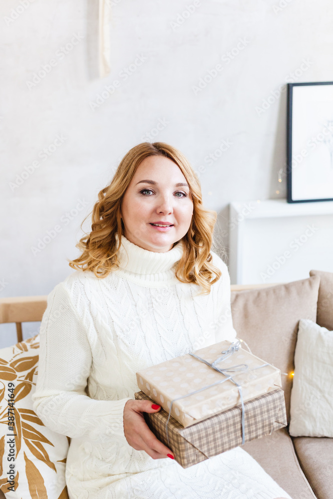 Woman holding gift, holiday gift, Christmas and new year preparation Woman holding gift, holiday gift, Christmas and new year preparation
