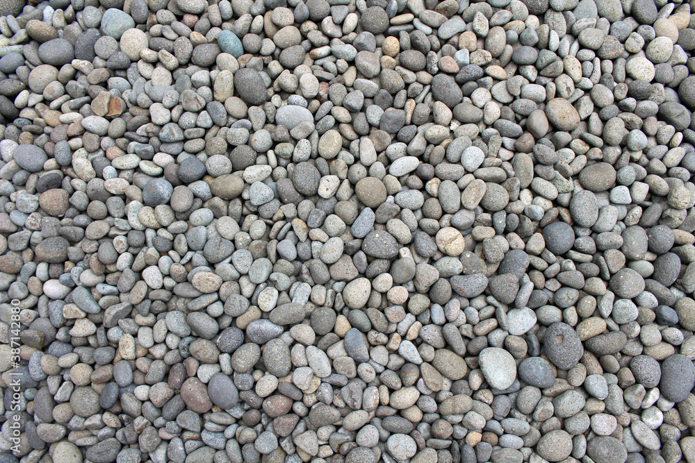 Pebbles, rocks, and stones as natural decoration in the garden. Pebbles, rocks, and stones as natural decoration in the garden.