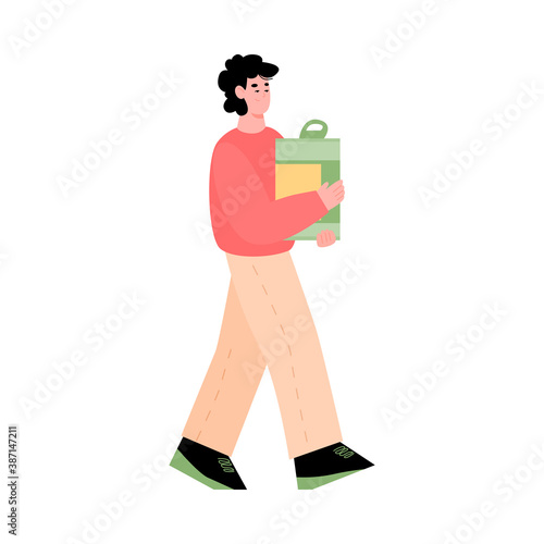 Young man volunteer carry cardboard box full of food for donation in social shelter or charitable center. Support and assistance for homeless and poor. Vector isolated illustration