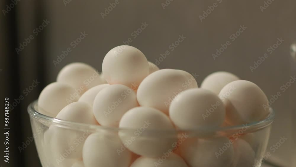Raw baking eggs closeup push in forward camera movement blurred background Raw baking eggs closeup push in forward camera movement blurred background