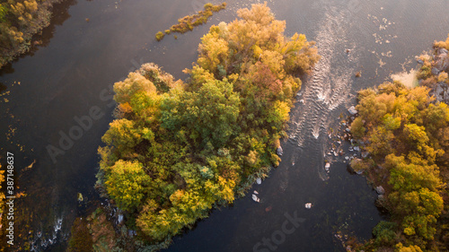 amazing aerial view of foggy morning river and colorful trees. drone shot