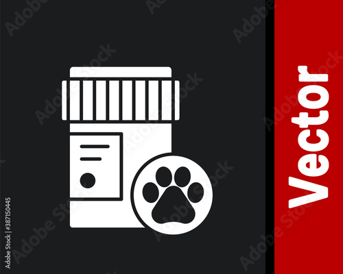 White Dog medicine bottle icon isolated on black background. Container with pills. Prescription medicine for animal. Vector.