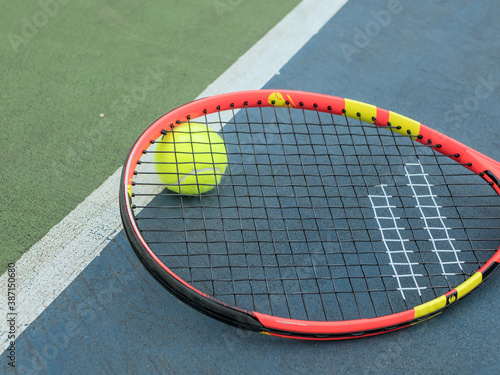 Tennis ball and racket on court, Tennis equipment © Valkantina