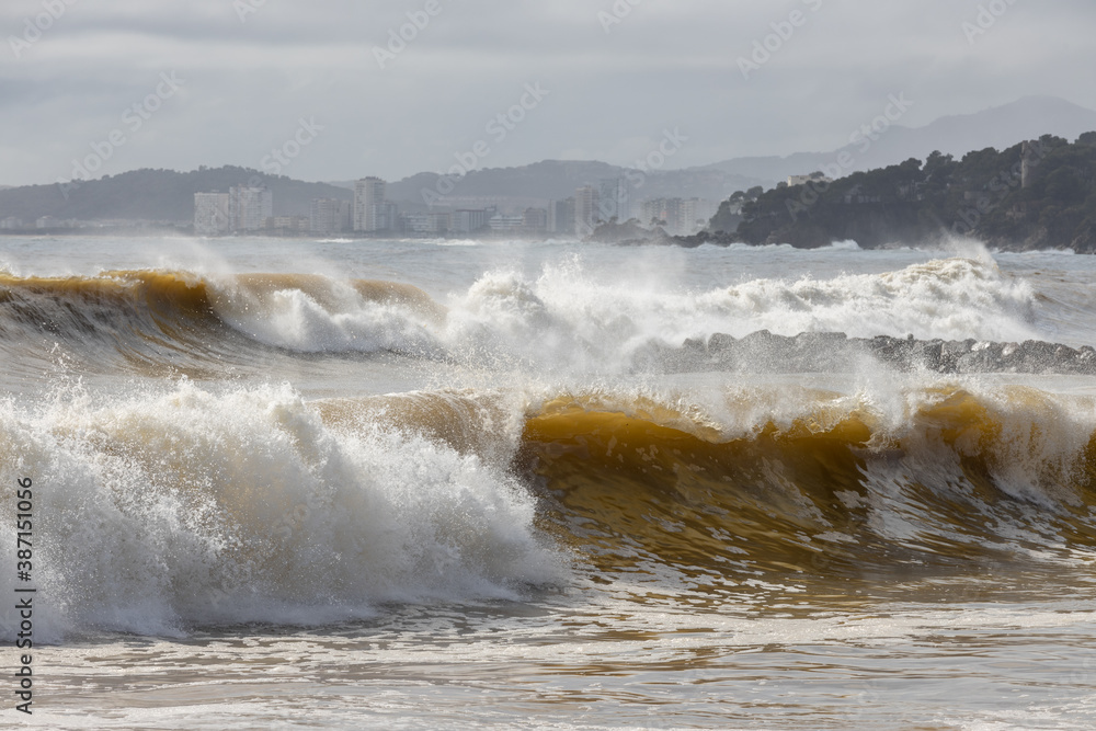 Powerful ocean wave breaking ina windy day Powerful ocean wave breaking ina windy day