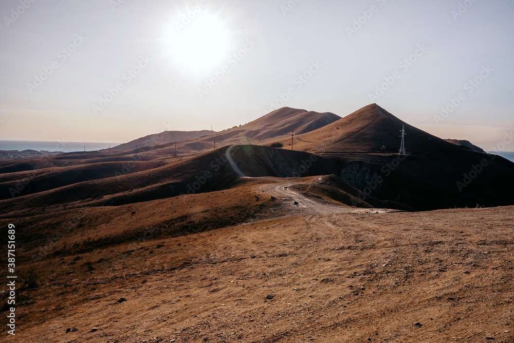 Landscape of hills at dawn with road