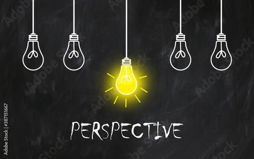 word : PERSPECTIVE, text with light bulb on blackboard 