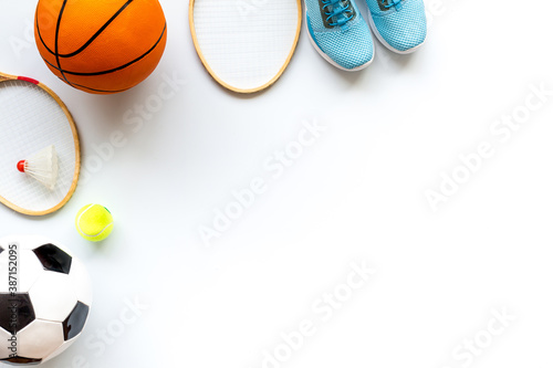 Sport games background - basketball  soccer ball  rackets  sneakers - copy space
