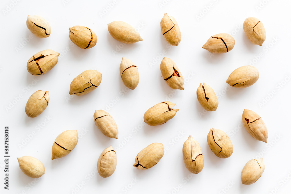 Pecan nuts pattern. Food background, top view