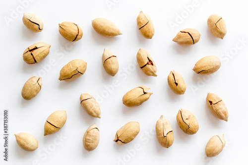 Pecan nuts pattern. Food background, top view