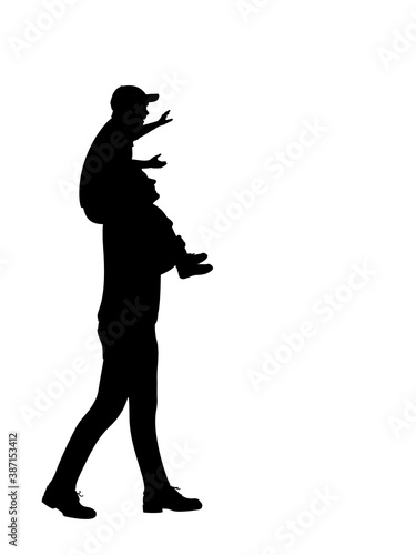 Silhouette of father carrying son on shoulders