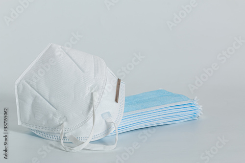 Medical mask blue and Mask KN95 on white background, COVID 19 protection ,pollution, virus,  Health care concept © chaphot