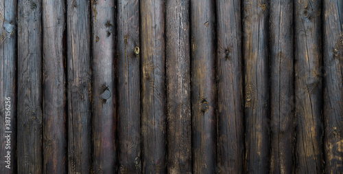 Dark brown wood texture background coming from natural tree. Wooden panel with beautiful patterns. Space for your work.