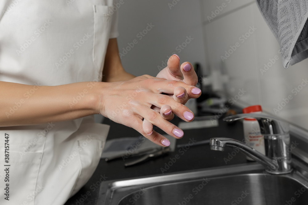 Women hand apply talcum powder. Doctor puts talcum powder on his hands before putting on gloves