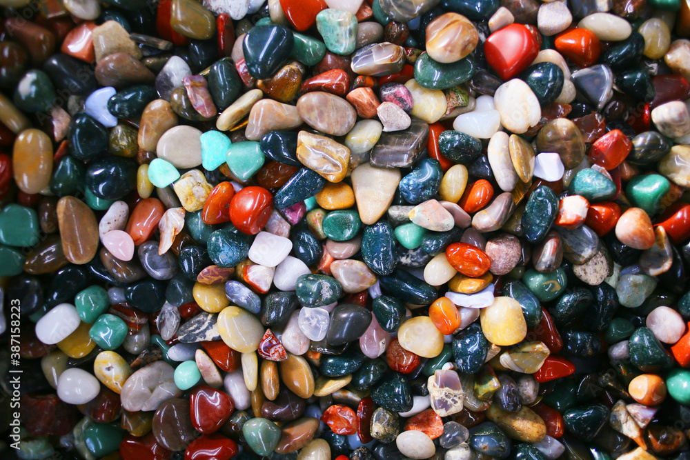 Colorful pebbles and rocks. Pile of stones of various colors. Rock texture. Colorful pebbles and rocks. Pile of stones of various colors. Rock texture.