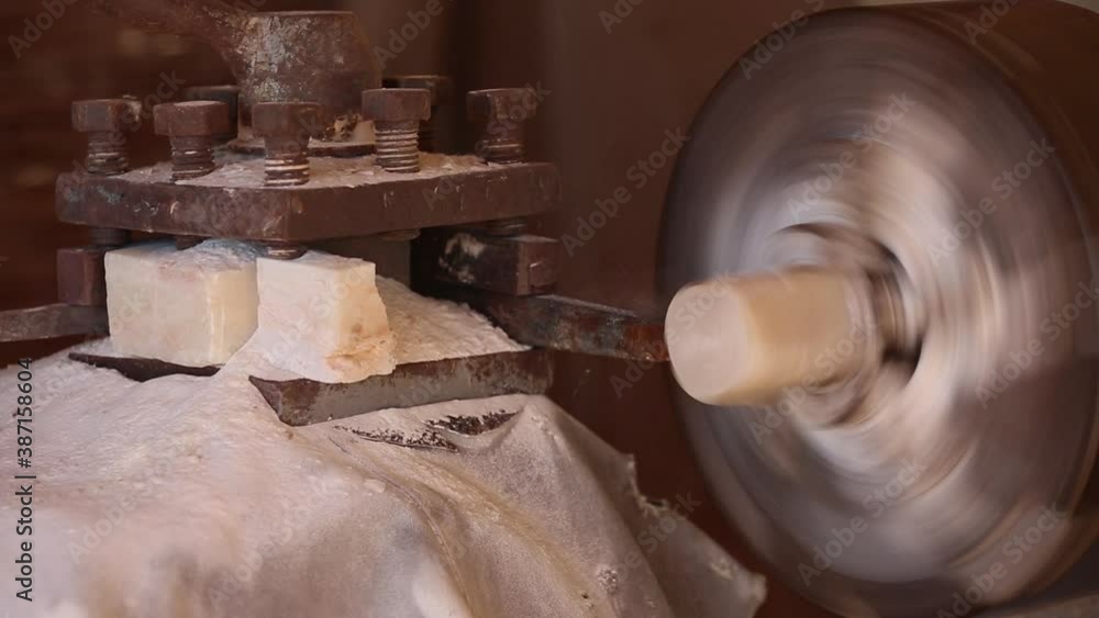 The processing of amber. Polishing and grinding pieces of amber. Making