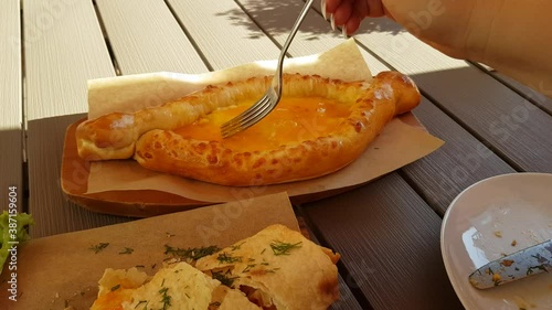 Khachapuri in Adjarian. Georgian national cheese pastry baked with egg photo