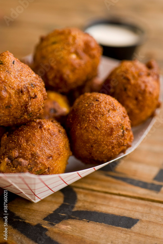 Hush puppies. Deep fried cornmeal made with onions, garlic and butter. Classic Cajun cuisine appetizer favorite. Classic New Orleans cuisine.