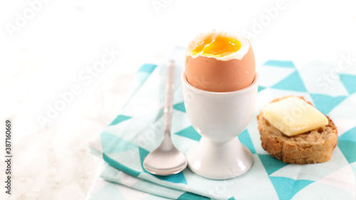 soft boiled egg and bread with butter