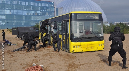 Police special forces are conducting an operation to free hostages taken by terrorists from the bus photo