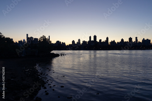 Silhouettes of Skyscrapers in the Upper East Side and Manhattan Skyline along the East River in New York City during the Evening
