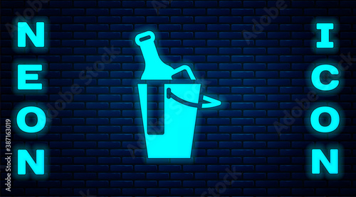 Glowing neon Bottle of wine in an ice bucket icon isolated on brick wall background. Vector.