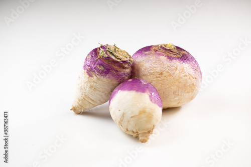 Freshly harvested spring turnips, Brassica rapa, on white background
