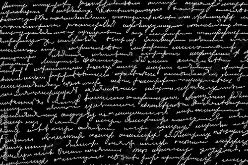 Texture of unreadable text written by hand on a black background. Unreadable sloppy handwriting.