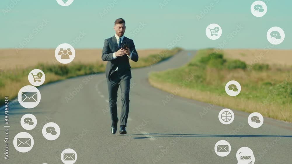Attractive businessman runs use smartphone near road wheat field freedom. Vlogger influencer around social media, app icons animation loud with white interface digital. Slow motion