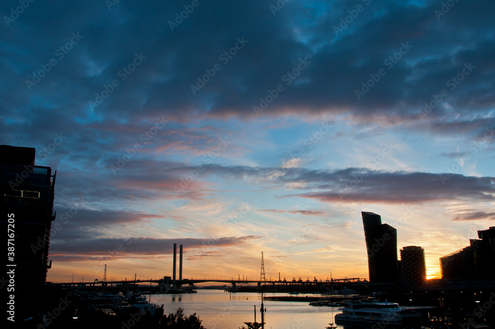 MELBOURNE, AUSTRALIA - JULY 26, 2018: Bolte Bridge from Docklands Melbourne Australia with Sunset MELBOURNE, AUSTRALIA - JULY 26, 2018: Bolte Bridge from Docklands Melbourne Australia with Sunset