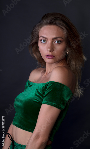 portrait of a young woman, shooting in a photo studio © vadim_fl