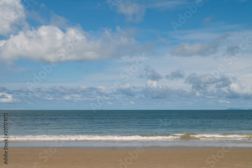Nature background of seashore beach wave and coastline  clear blue sky with cloud  and sunlight water surface for holiday relaxation lifestyle landscape concept