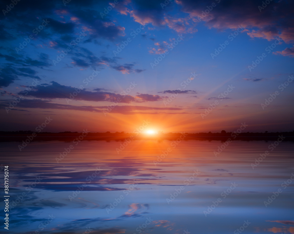 sunset over lake water surface