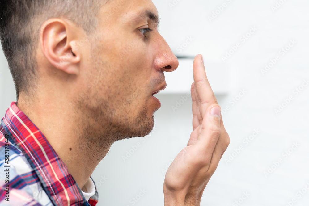Calm young Caucasian male enjoy pleasant smell or fragrance, relaxed European man in shirt breath deep, feel mindful inhaling fresh air. Stress free concept Calm young Caucasian male enjoy pleasant smell or fragrance, relaxed European man in shirt breath deep, feel mindful inhaling fresh air. Stress free concept