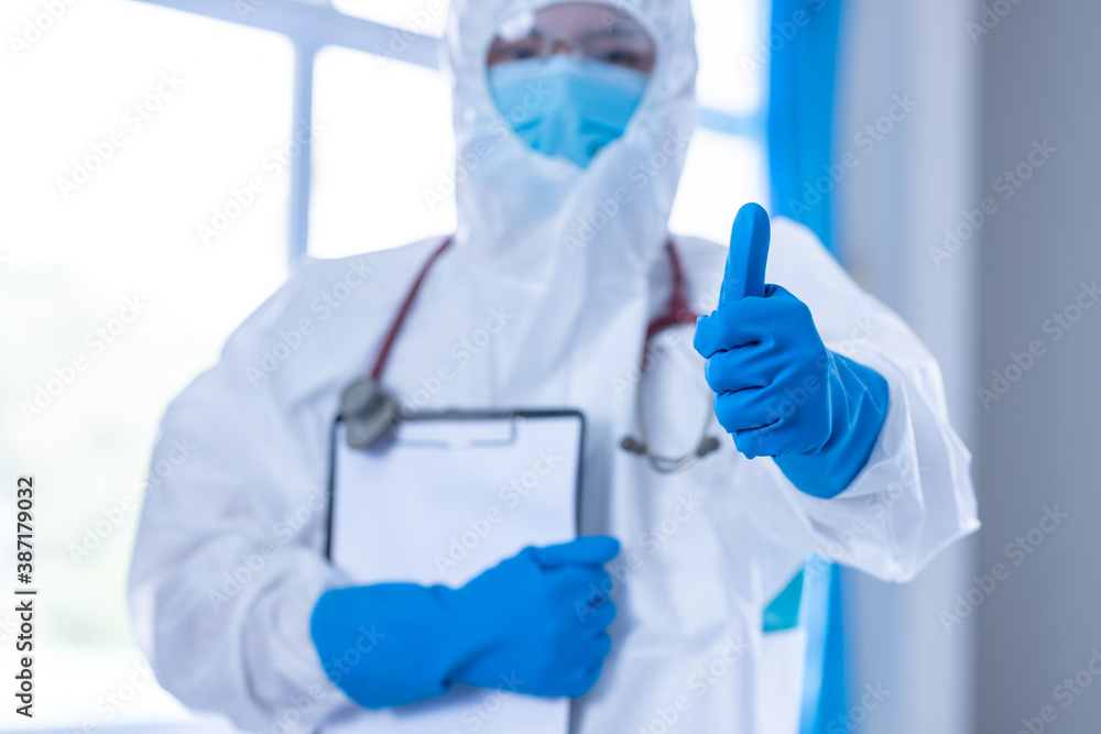 Doctor wear PPE and thumbs up to ensure the prevention of the spread of coronavirus disease or COVID-19 outbreak. Doctor wear PPE and thumbs up to ensure the prevention of the spread of coronavirus disease or COVID-19 outbreak.