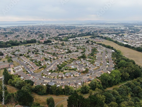 aerial view of bungalows on a modern housing estate looking towards the harbour in the background