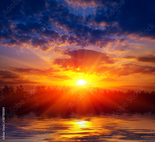 sunset over lake water surface © Pavlo Klymenko