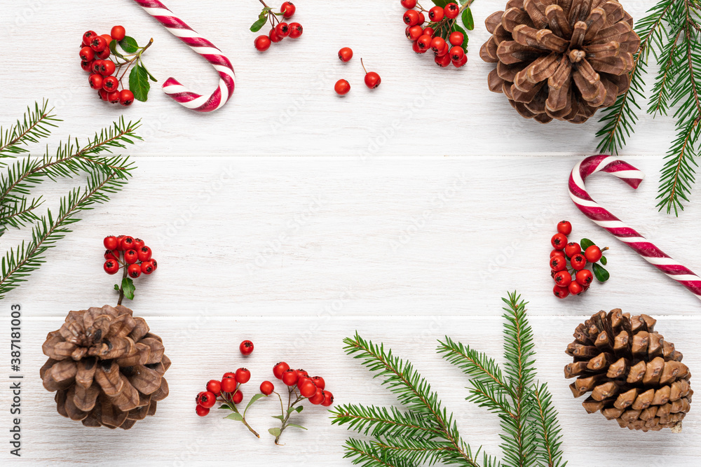 Christmas decorations on white slatted wooden background. Frame copy space, top view Christmas decorations on white slatted wooden background. Frame copy space, top view