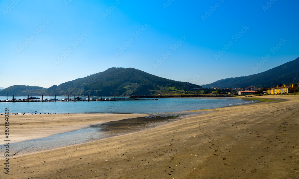 View of calm and solitary beach in the village of Cariño in the northern Galicia region of Spain.