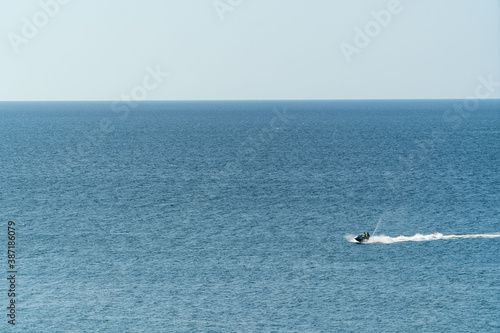 people riding on a jet ski © Aleksandr